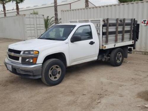 2010 CHEVROLET COLORADO FLATBED TRUCK, 3.7L gasoline, automatic, a/c, pw, pdl, pm, 7' flatbed, stake sides, Tommy Gate lift gate. s/n:1GBHSBDEXA8141454 **(DEALER, DISMANTLER, OUT OF STATE BUYER, OFF-HIGHWAY USE ONLY)**