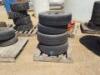 (7) PALLETS OF MISC. RIMS W/TIRES, (7) rims w/tires, (4) rims w/solid tires, fits Reachlift., (16) rims w/solid tires, fits skidsteer. **(LOCATED IN COLTON, CA)**
